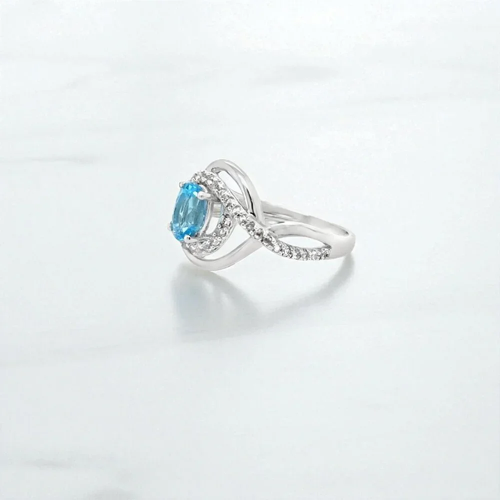 Silver Ring with Bright Blue Gemstone and Halo Accents